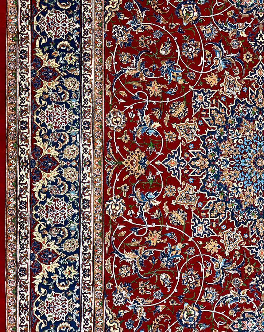 "Persian masterpiece rug with vibrant red field and detailed borders."